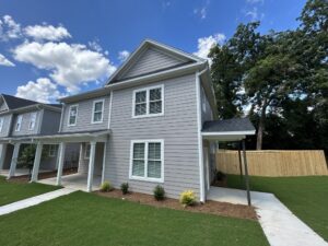 SCBRS property manager in front of a Columbia SC rental home in the 29205 zip code